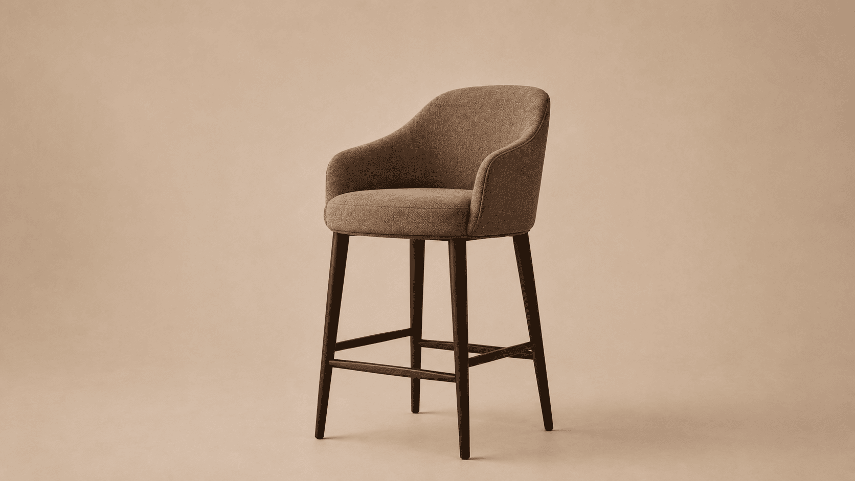 Upholstered bar stool in warm neutral fabric